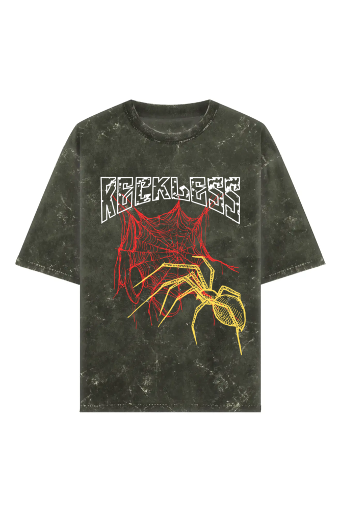 Black acid-wash t-shirt with bold RECKLESS text, red spider web, and yellow spider graphic