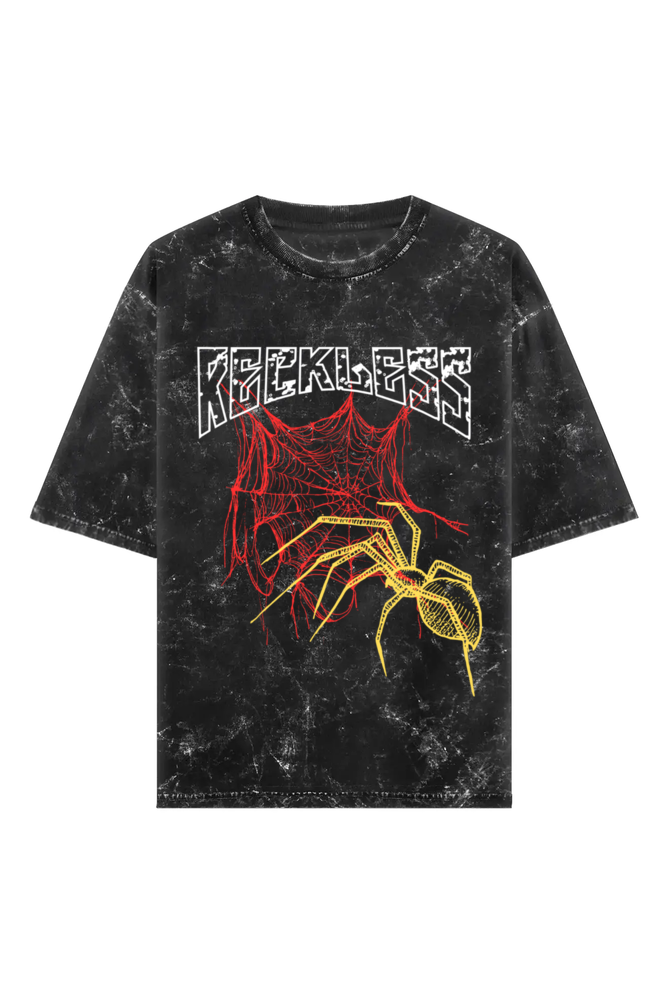 Black t-shirt with distressed texture, featuring yellow spider and red spiderweb graphic and bold white RECKLESS text